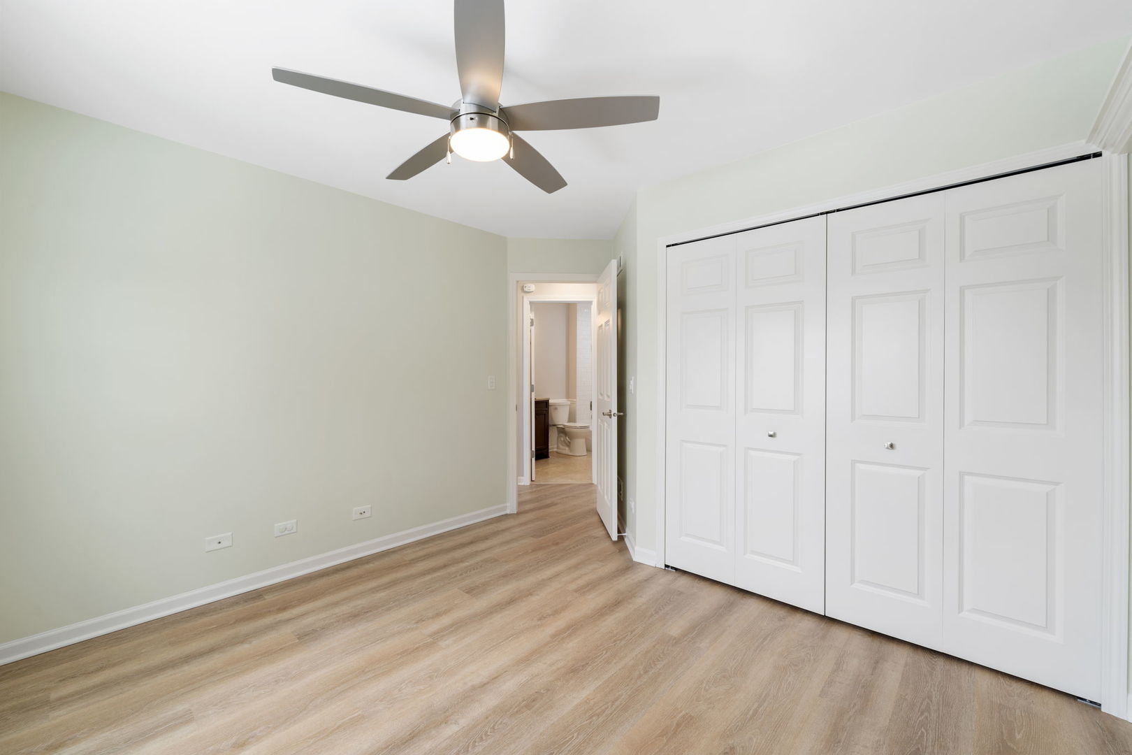 1264 Rhodes Lane Naperville, IL 60540 - Photo 32 of 35 a view of an empty room with wooden floor