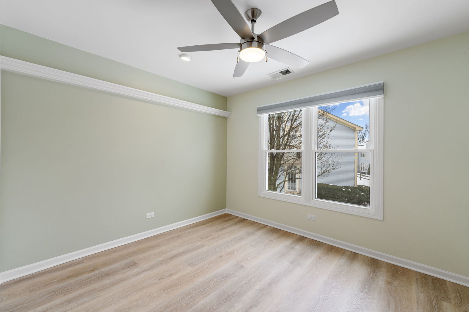 1264 Rhodes Lane Naperville, IL 60540 - Photo 33 of 35 an empty room with wooden floor chandelier and windows