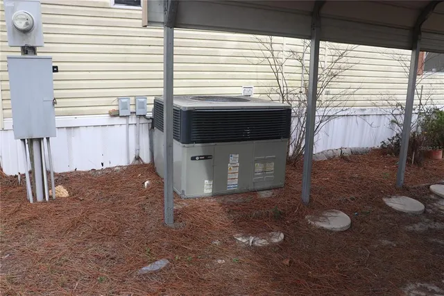 a view of a porch with a table and chairs