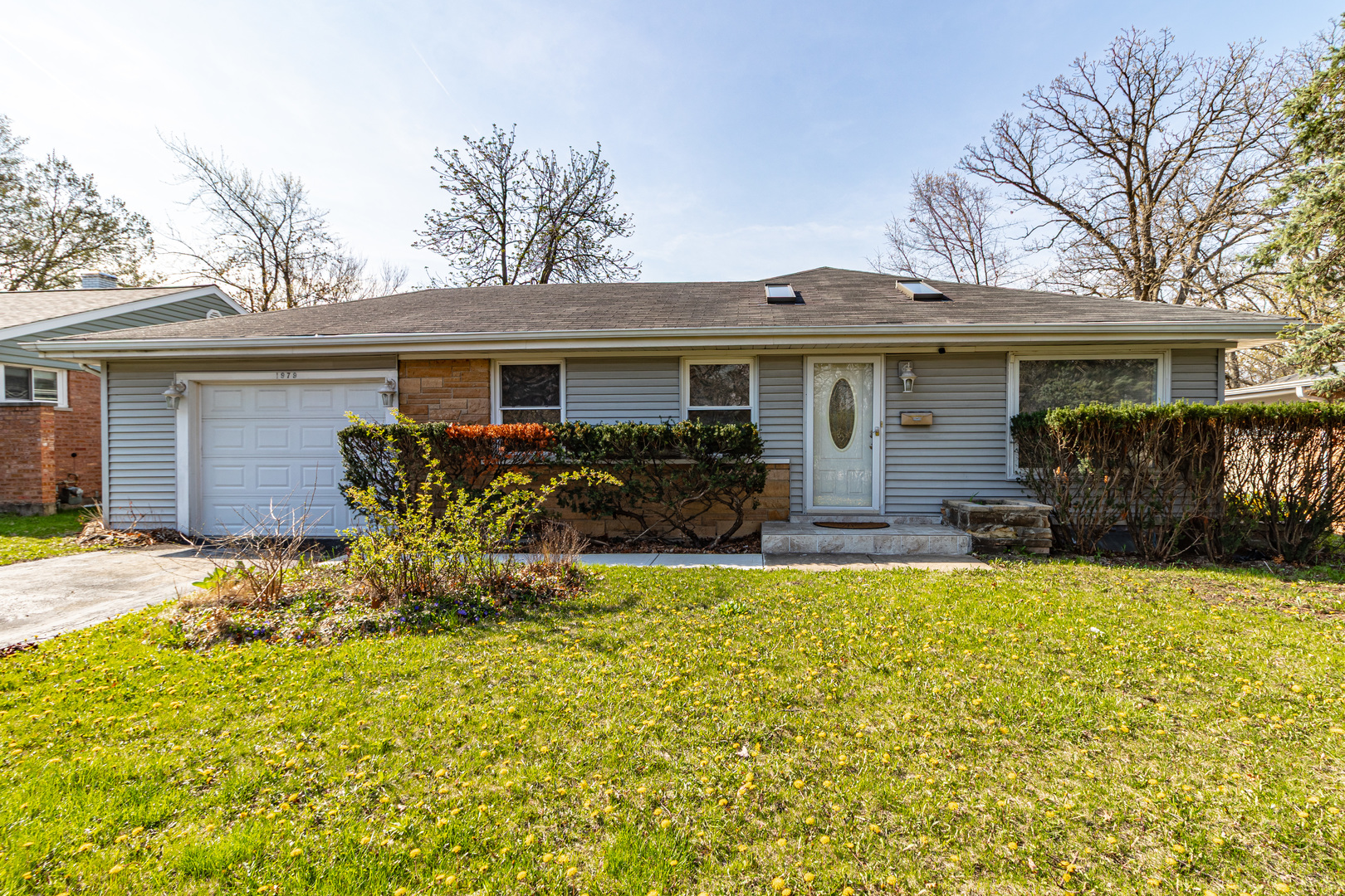 1979 Dundee Road Northbrook, IL 60062 - Photo 1 of 28 a front view of house with yard and seating area