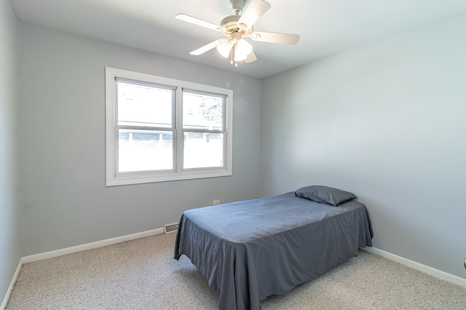 1979 Dundee Road Northbrook, IL 60062 - Photo 14 of 28 a bedroom with a bed and a ceiling fan