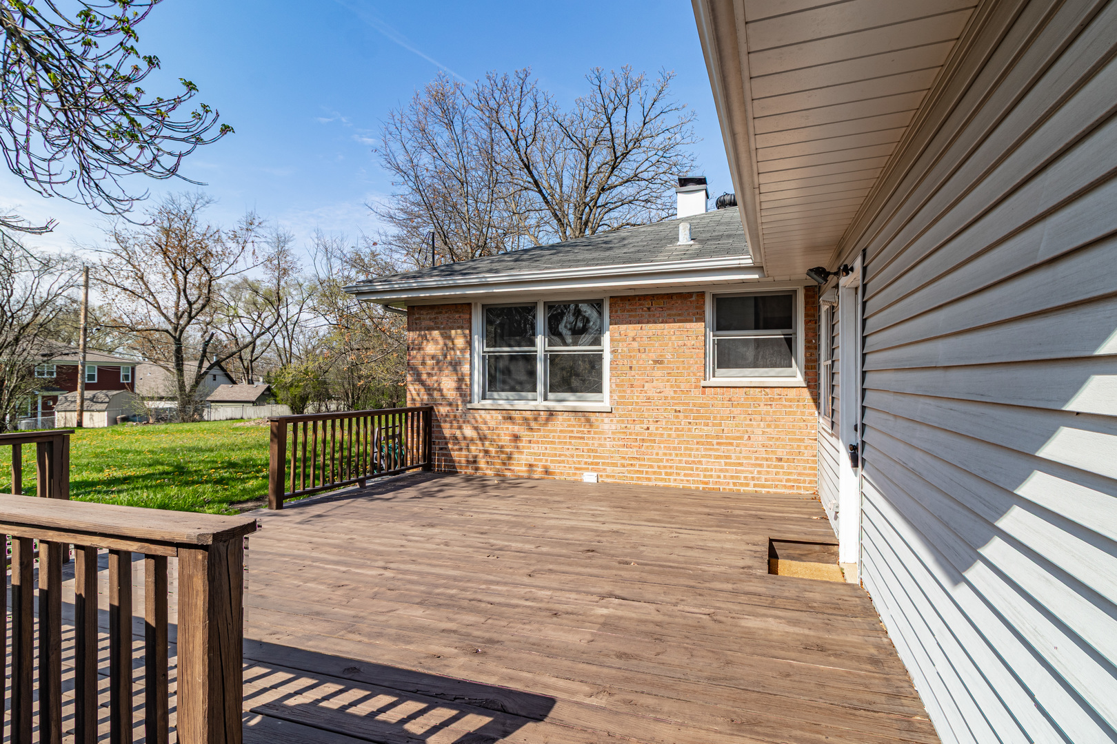 1979 Dundee Road Northbrook, IL 60062 - Photo 24 of 28 a view of a house with a wooden deck and a yard