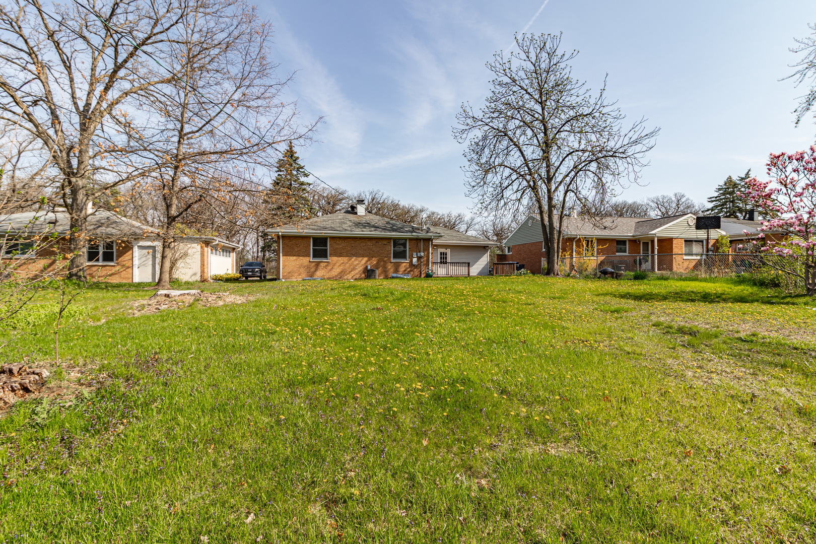 1979 Dundee Road Northbrook, IL 60062 - Photo 27 of 28 a view of a house with a big yard and large trees
