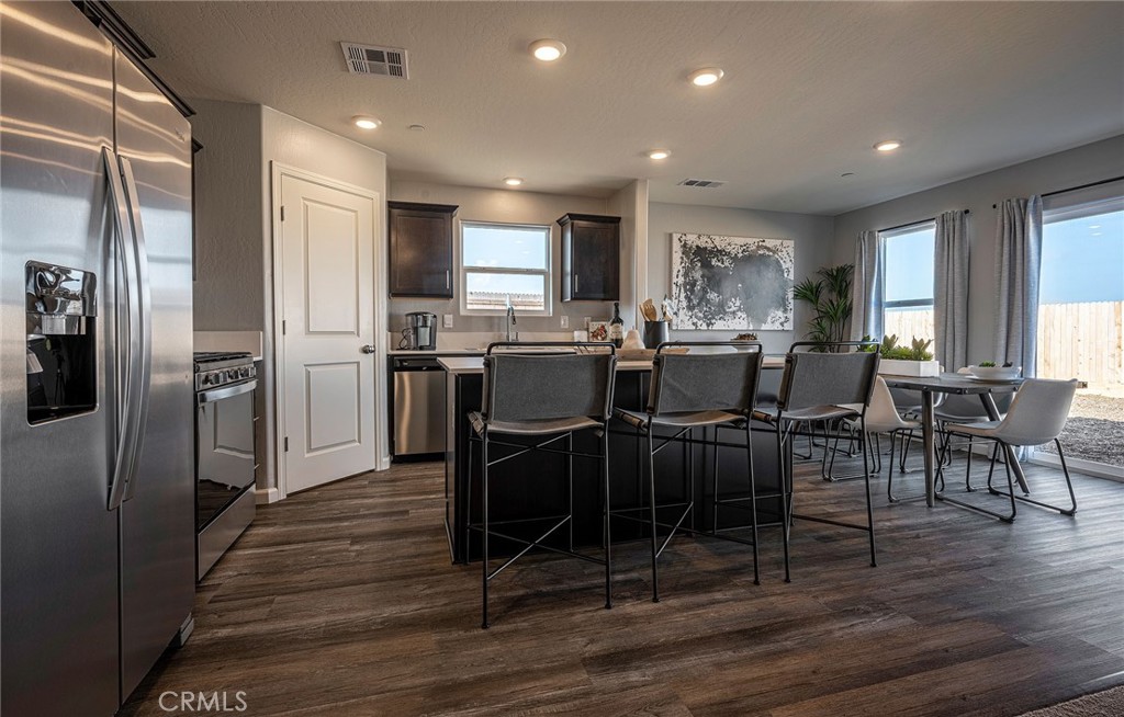 4777 Jema Way, Unit 11 B1 Merced, CA 95348 - Photo 5 of 19 a view of a dining room with furniture window and wooden floor
