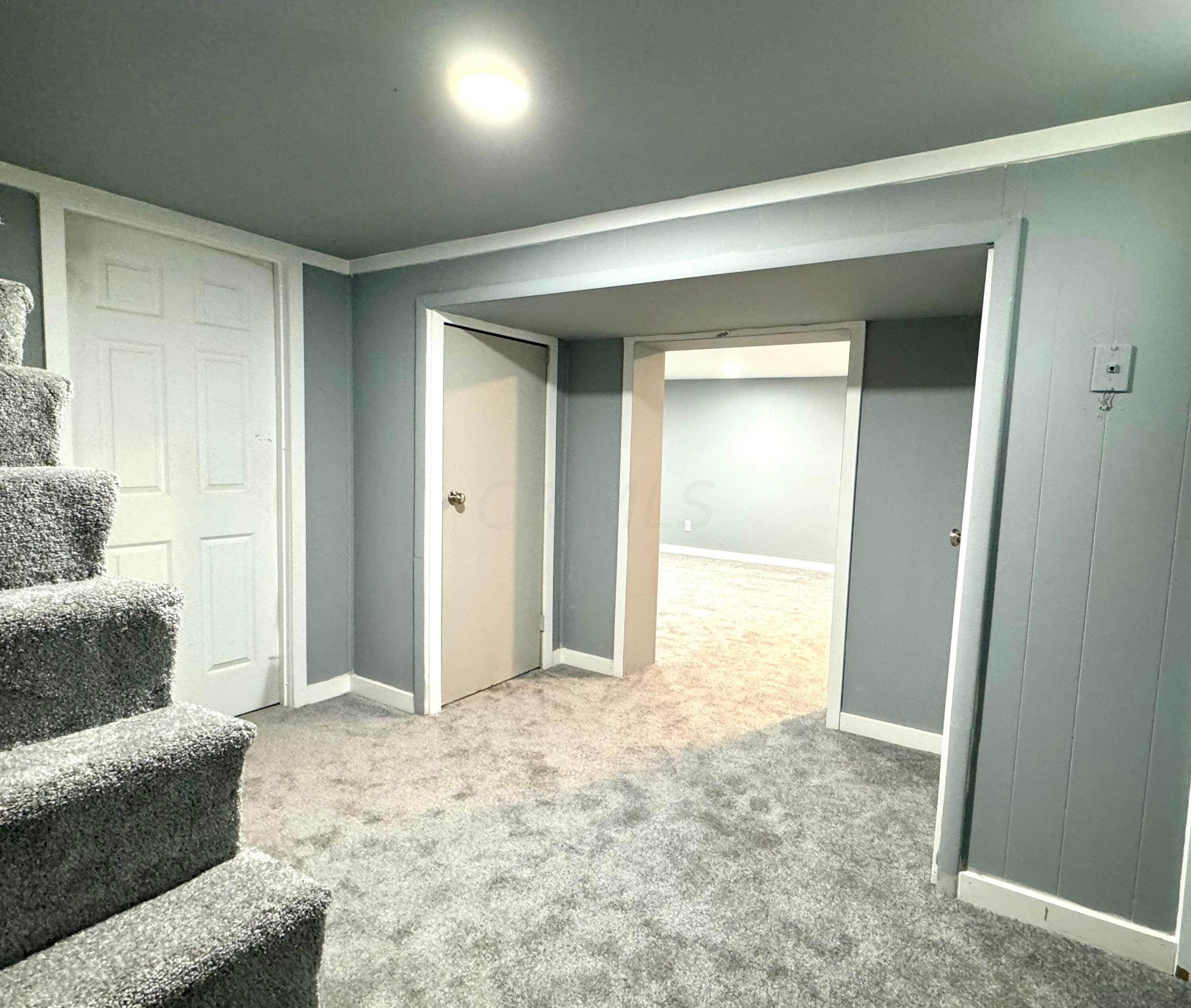 609 Raleigh Drive Columbus, OH 43228 - Photo 21 of 33 Lower level foyer with entry to family room, double closets, and utility room.