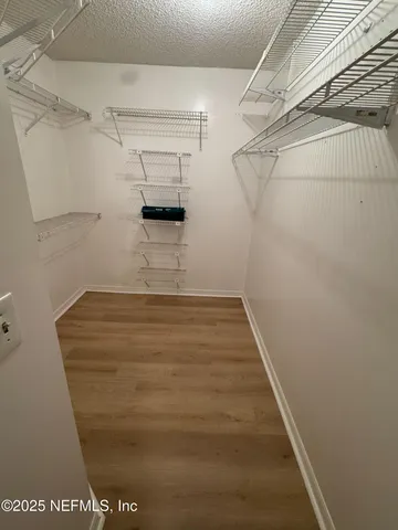 a view of a room with racks on the wall