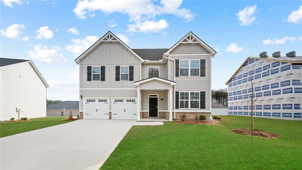 113 Oakchase Pk Lane Hampton, GA 30228 - Photo 1 of 34 a front view of a house with a yard