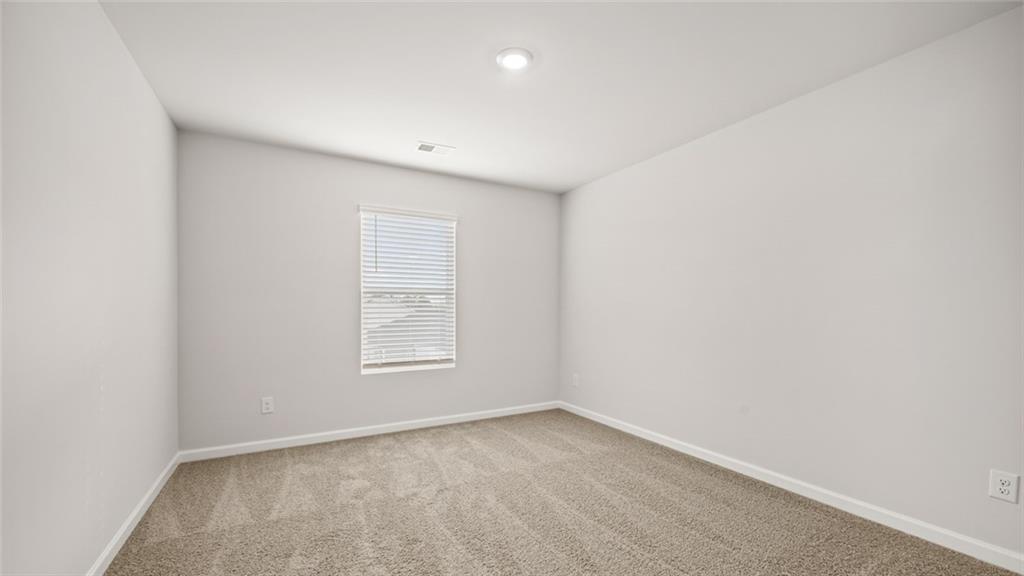 113 Oakchase Pk Lane Hampton, GA 30228 - Photo 16 of 34 an empty room with a window
