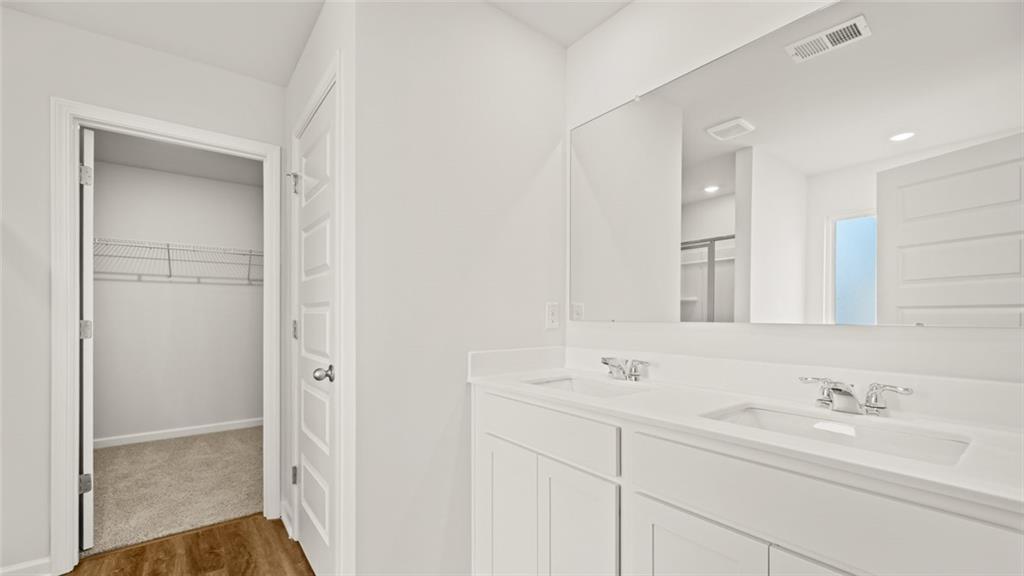 113 Oakchase Pk Lane Hampton, GA 30228 - Photo 21 of 34 a bathroom with a sink a toilet and a mirror