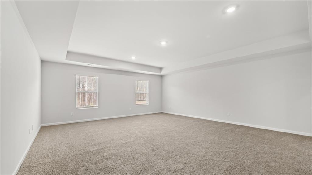 113 Oakchase Pk Lane Hampton, GA 30228 - Photo 22 of 34 an empty room with windows