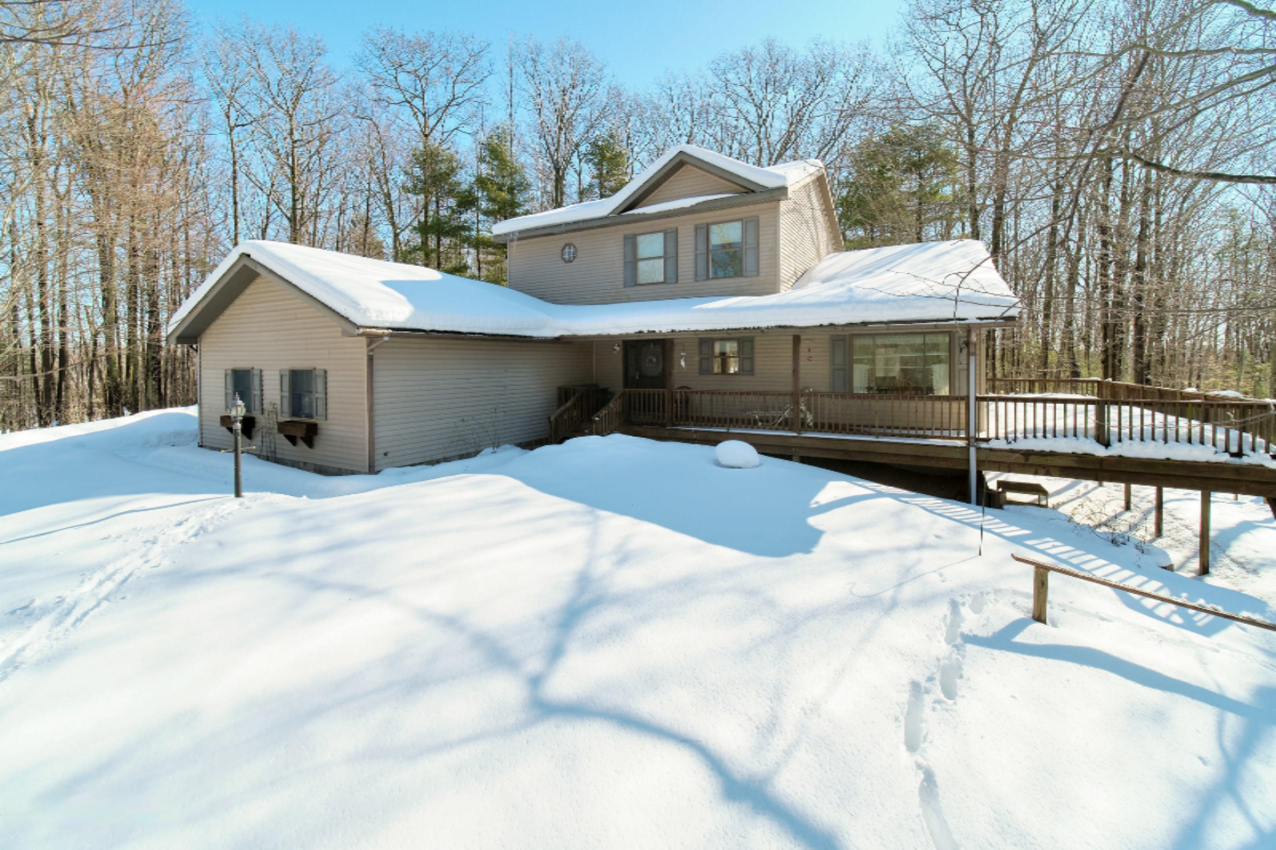 9800 Emerald Ridge Trail Onekama, MI 49675 - Photo 1 of 66 Tucked into 5 wooded acres