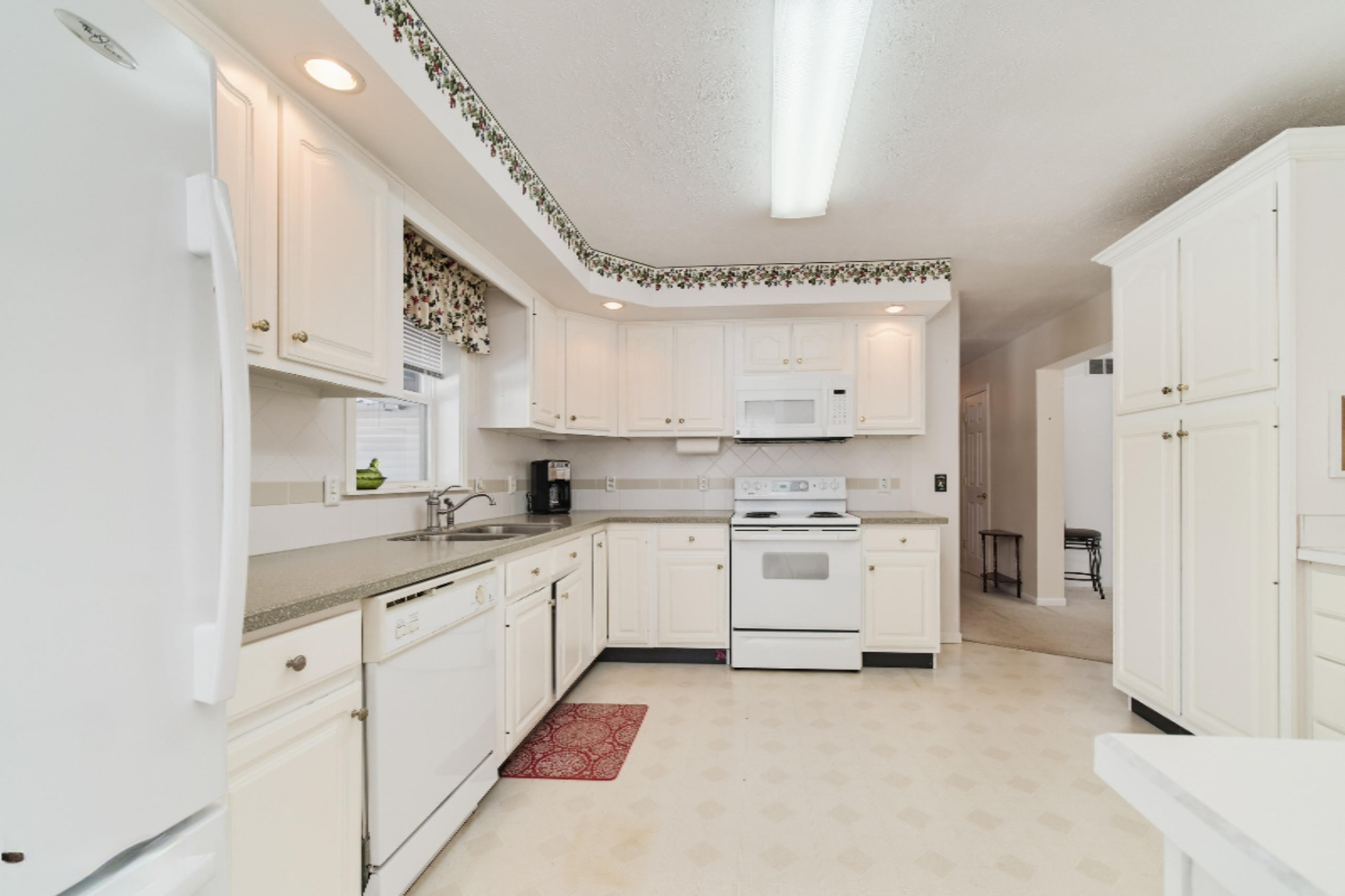 9800 Emerald Ridge Trail Onekama, MI 49675 - Photo 11 of 66 Expansive white cabinets