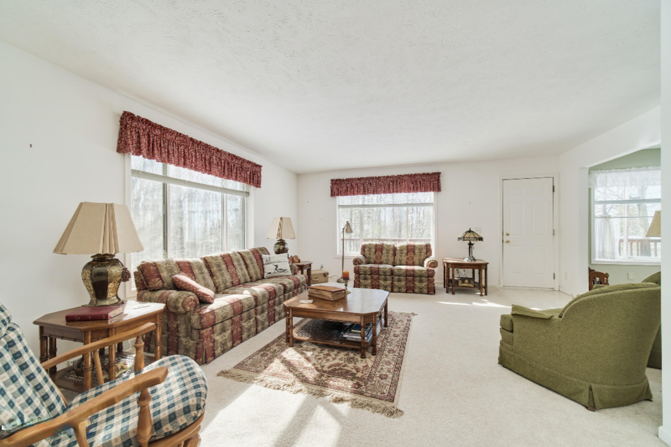 9800 Emerald Ridge Trail Onekama, MI 49675 - Photo 17 of 66 Living room walks out to deck