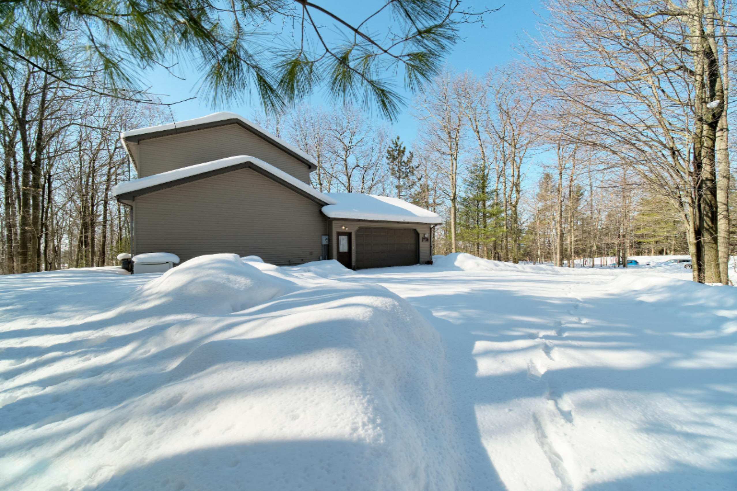 9800 Emerald Ridge Trail Onekama, MI 49675 - Photo 46 of 66 2 car attached garage