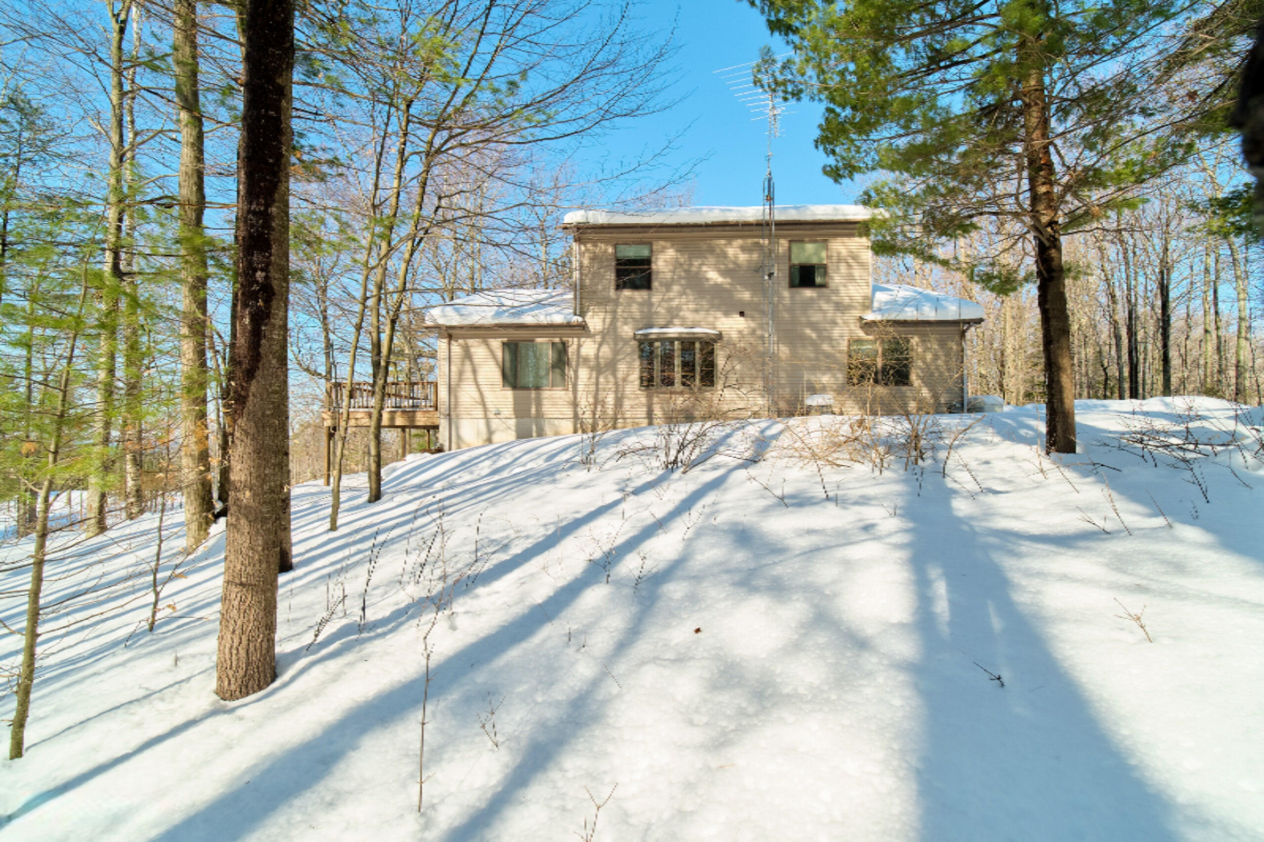 9800 Emerald Ridge Trail Onekama, MI 49675 - Photo 54 of 66 Back of home