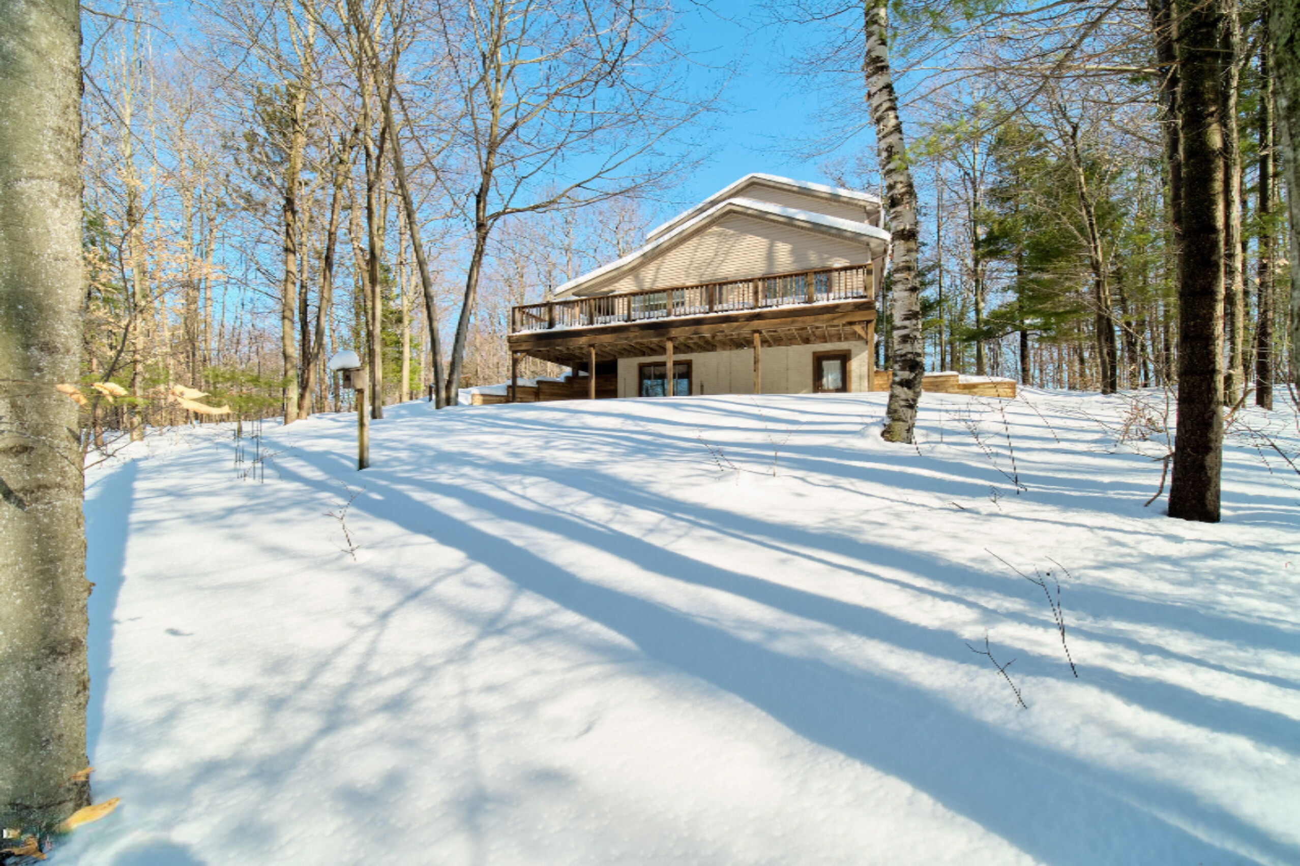 9800 Emerald Ridge Trail Onekama, MI 49675 - Photo 56 of 66 Exceptional walk around deck