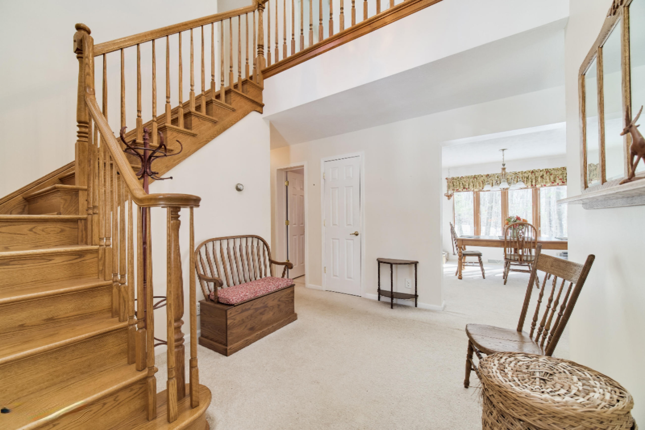 9800 Emerald Ridge Trail Onekama, MI 49675 - Photo 9 of 66 Dramatic oak open staircase
