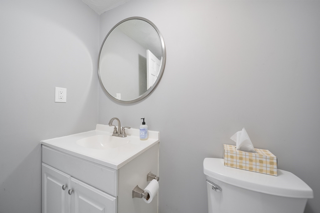 45 Washington Street, Unit 55 Methuen, MA 01844 - Photo 17 of 36 a bathroom with a sink a mirror and a toilet