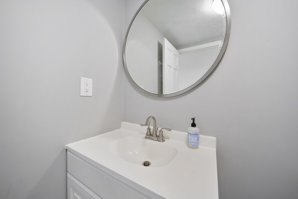 45 Washington Street, Unit 55 Methuen, MA 01844 - Photo 18 of 36 a bathroom with a sink and a mirror