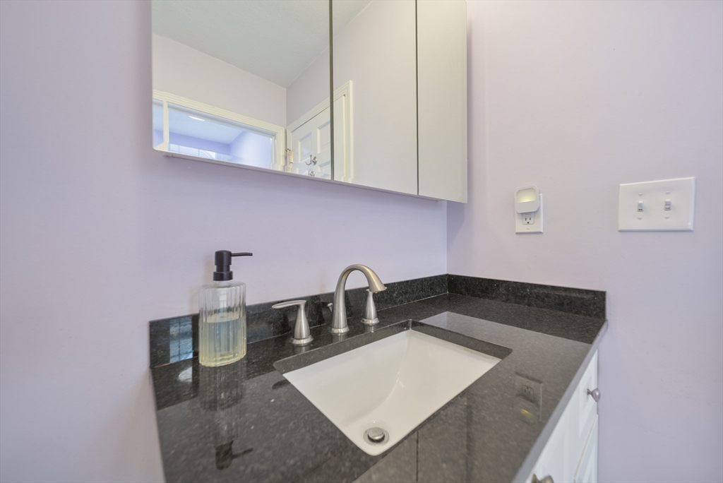 45 Washington Street, Unit 55 Methuen, MA 01844 - Photo 28 of 36 a kitchen with a sink and cabinets