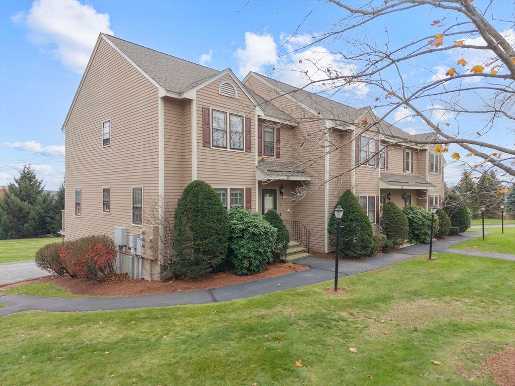 45 Washington Street, Unit 55 Methuen, MA 01844 - Photo 31 of 36 a front view of a house with a yard