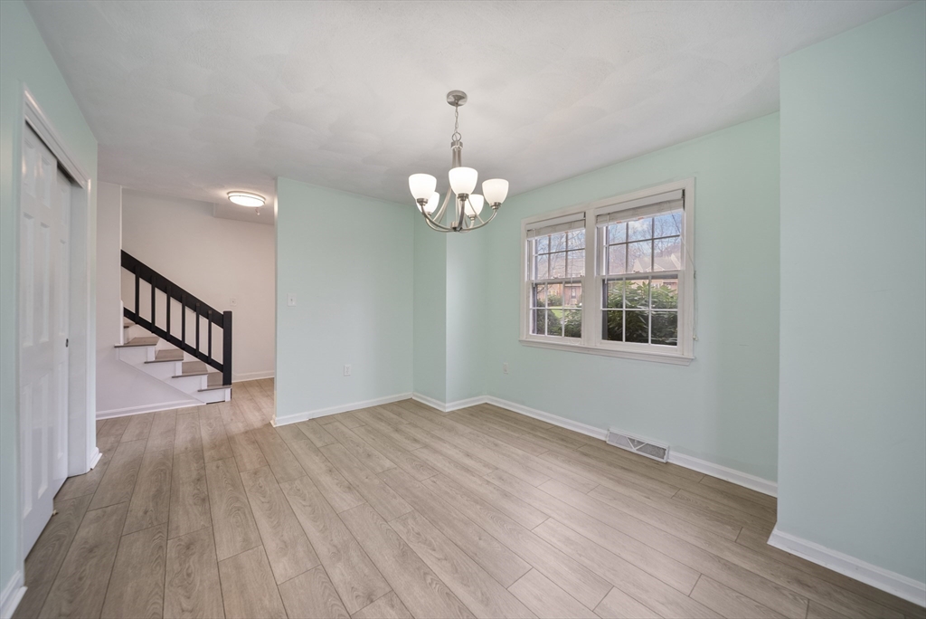 45 Washington Street, Unit 55 Methuen, MA 01844 - Photo 7 of 36 a view of livingroom with window and hardwood floor