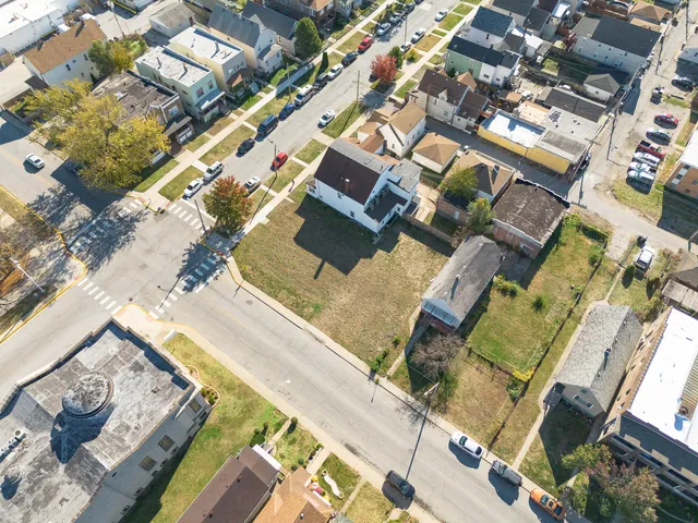 an aerial view of a house with a garden