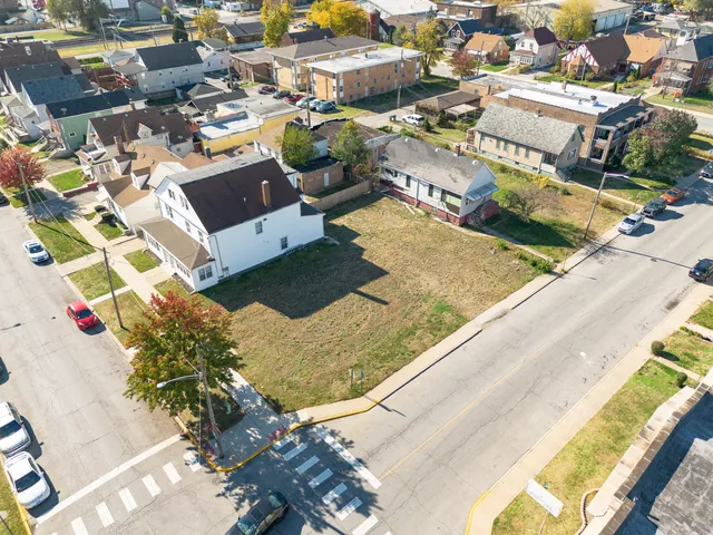 an aerial view of residential houses with outdoor space