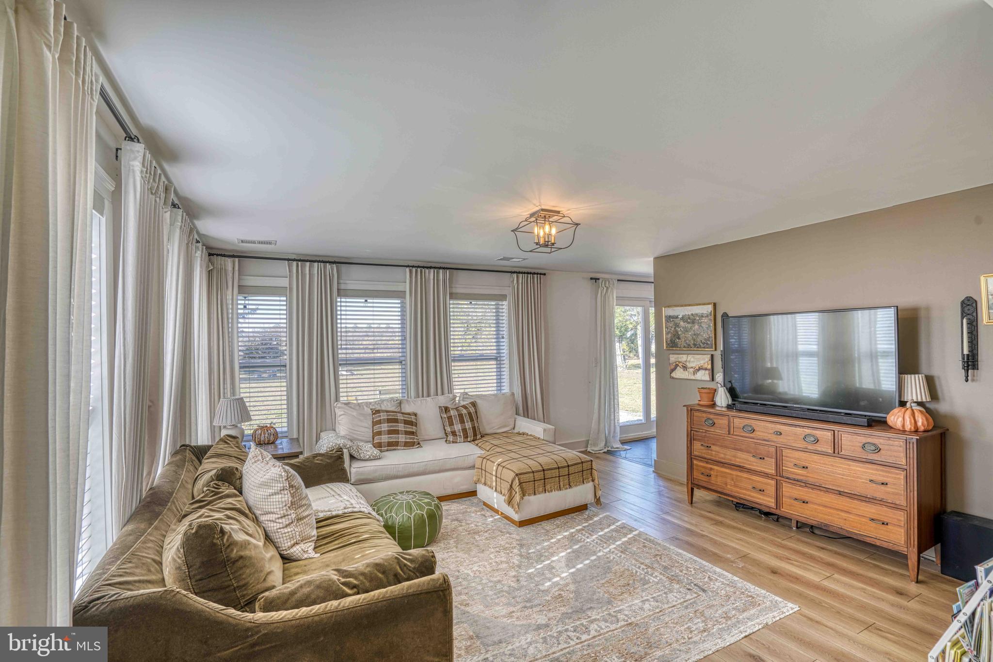 3540 Houston Branch Road Federalsburg, MD 21632 - Photo 11 of 35 a living room with furniture and a flat screen tv