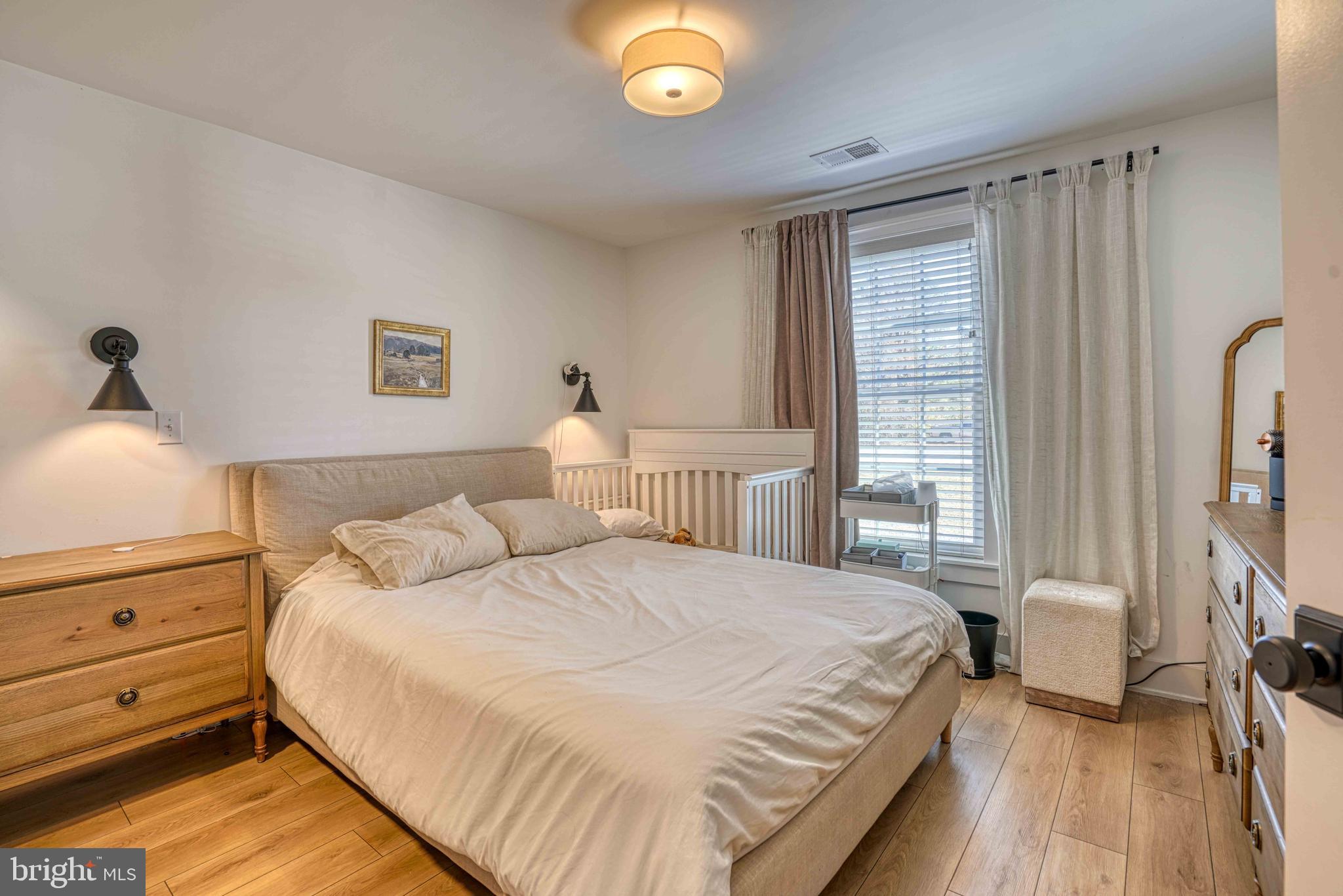 3540 Houston Branch Road Federalsburg, MD 21632 - Photo 12 of 35 a bedroom with a bed and a flat tv screen on dresser