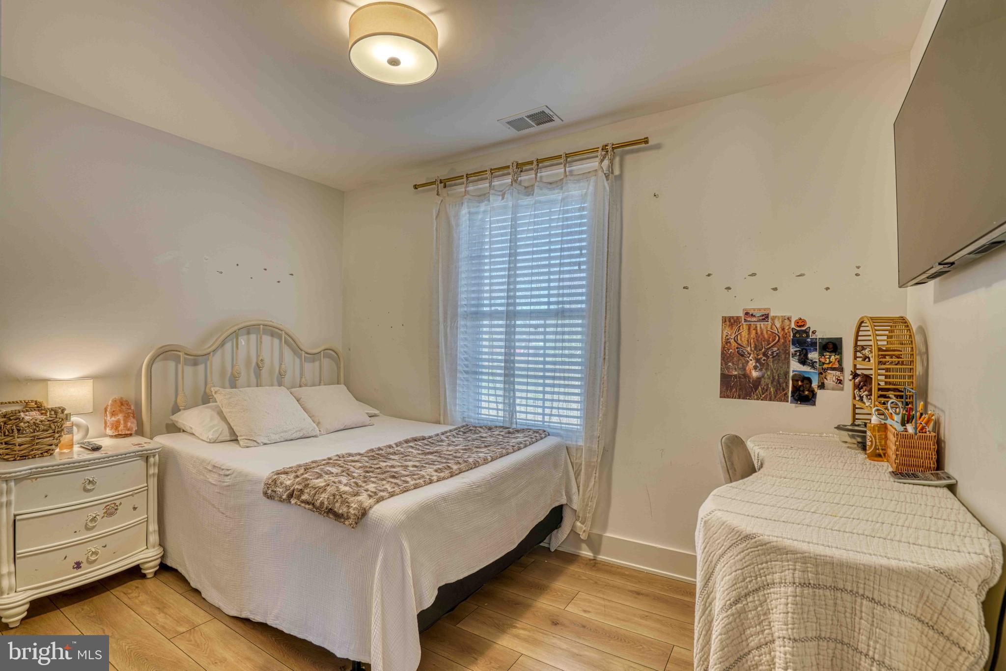 3540 Houston Branch Road Federalsburg, MD 21632 - Photo 16 of 35 a bedroom with a bed and a lamp on dresser