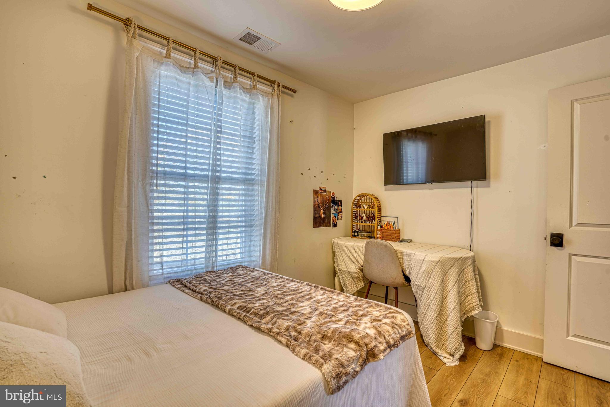 3540 Houston Branch Road Federalsburg, MD 21632 - Photo 18 of 35 a bedroom with a bed and a flat screen tv