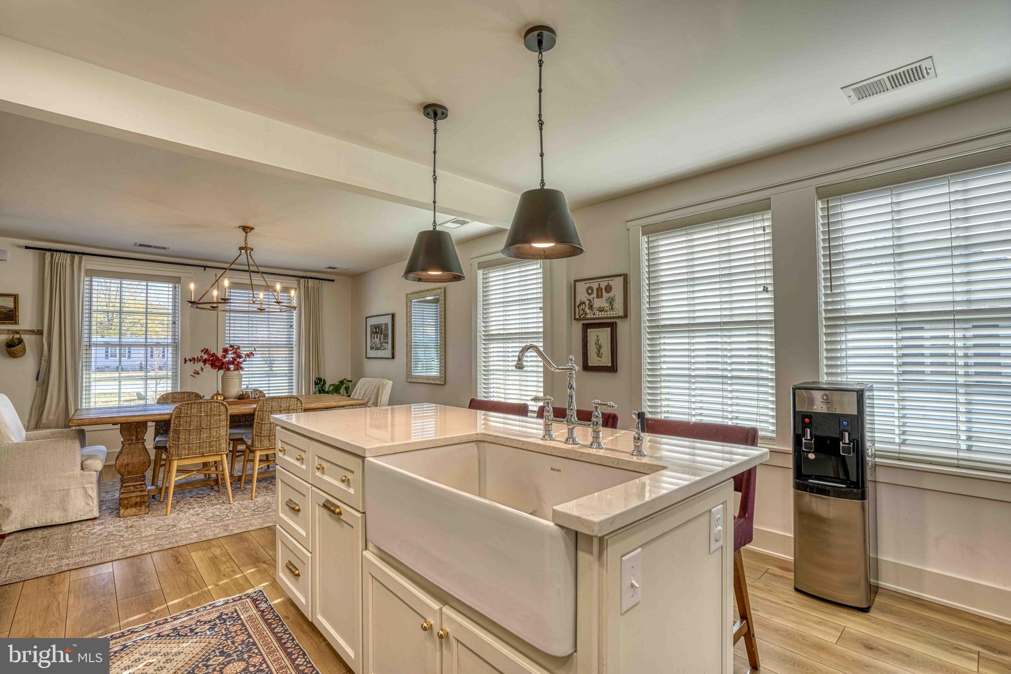 3540 Houston Branch Road Federalsburg, MD 21632 - Photo 26 of 35 a kitchen with stainless steel appliances granite countertop a sink a stove and a wooden floors