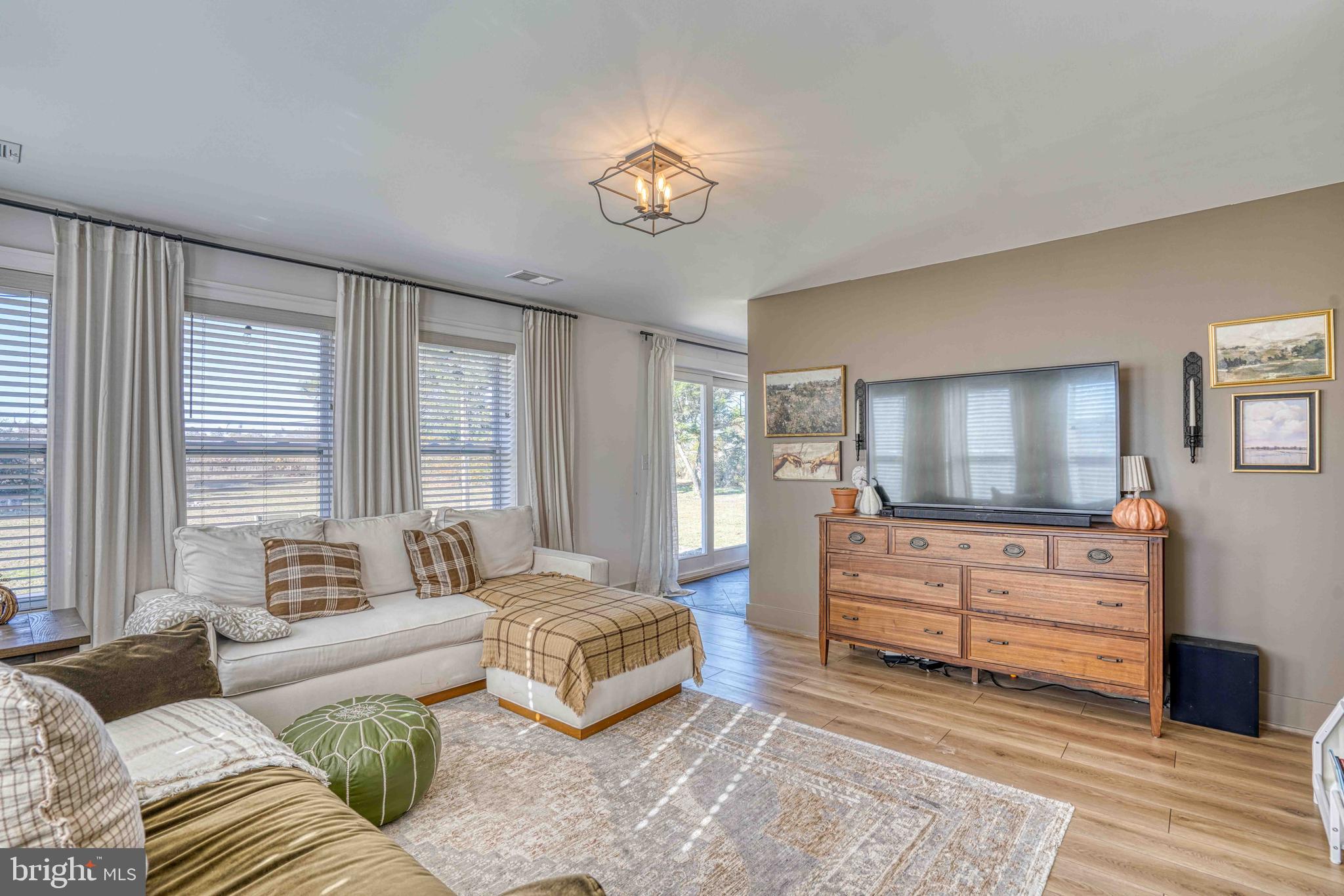 3540 Houston Branch Road Federalsburg, MD 21632 - Photo 28 of 35 a living room with furniture and a flat screen tv