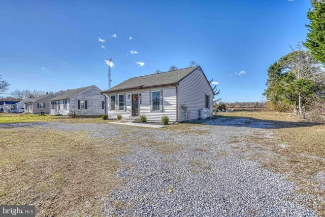 a view of house with yard and outdoor space