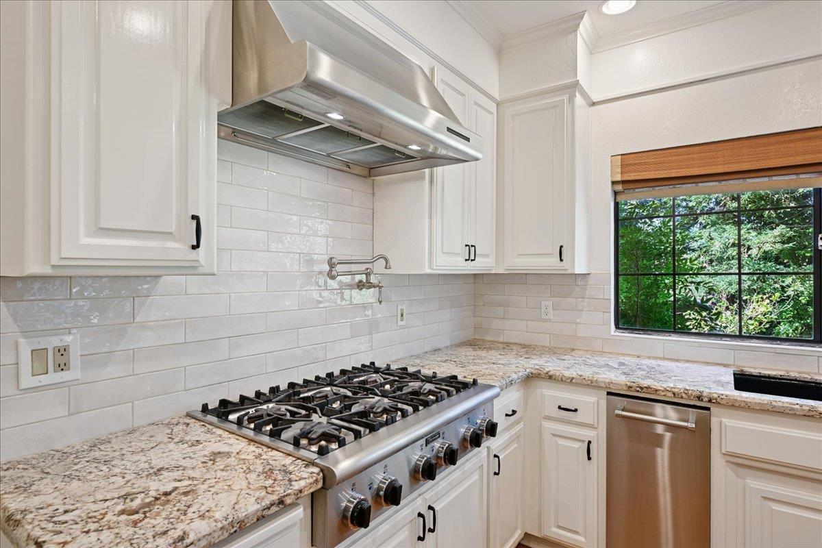 4608 Danvers Lane Granite Bay, CA 95746 - Photo 19 of 74 a kitchen with white cabinets and appliances