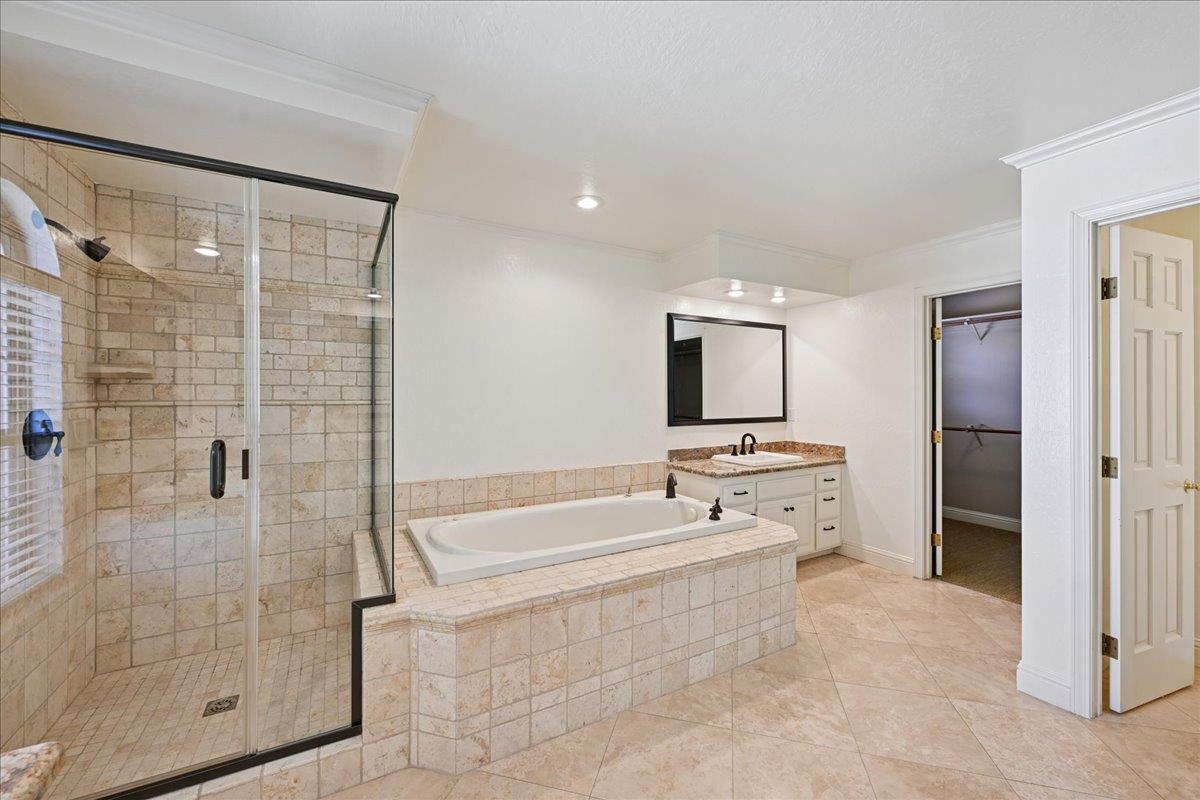 4608 Danvers Lane Granite Bay, CA 95746 - Photo 53 of 74 a spacious bathroom with a tub shower and mirror