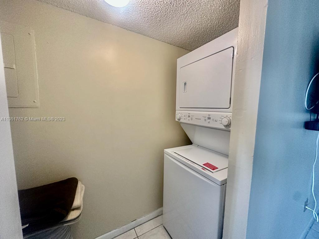 3199 Foxcroft Road, Unit 309 Miramar, FL 33025 - Photo 10 of 21 a utility room with dryer and washer