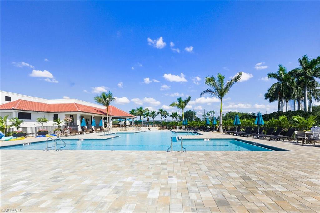 209 Countryside Drive Naples, FL 34104 - Photo 35 of 50 Community pool with a patio