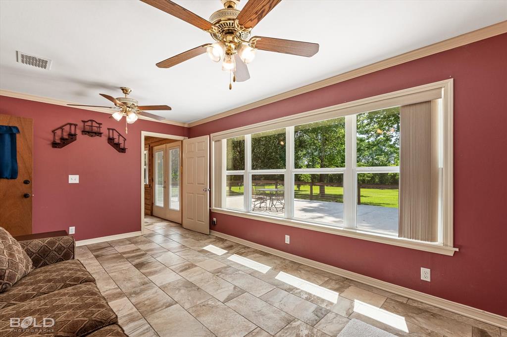 225 Marie Road Ringgold, LA 71068 - Photo 35 of 40 Expansive window wall with multiple panes overlooking a green expanse