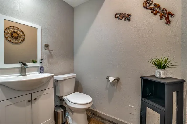 a bathroom with a sink and a washer dryer