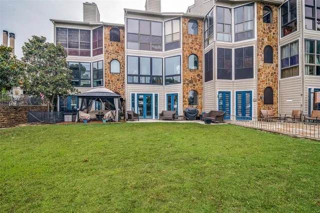 a view of a big yard with a large trees