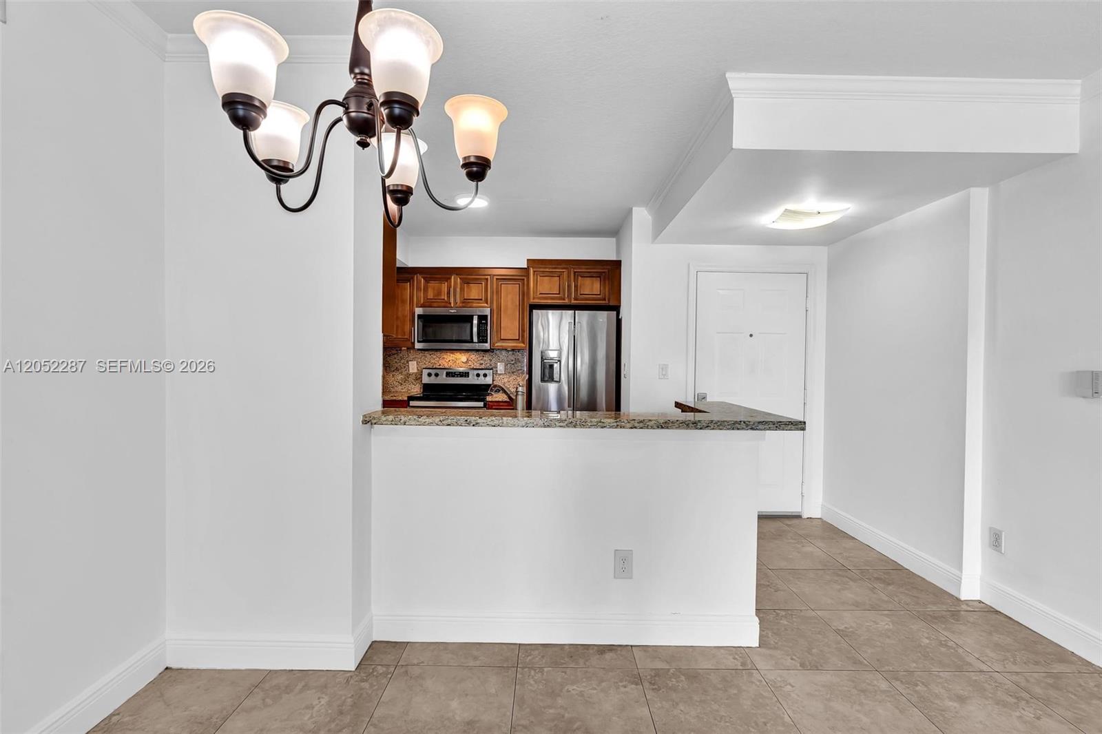 2665 Southwest 37th Avenue, Unit 313 Miami, FL 33133 - Photo 10 of 24 Looking into kitchen from living room. This floor plan invites enterainment.