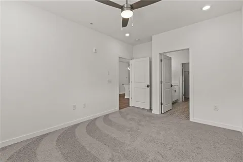an empty room with a ceiling fan