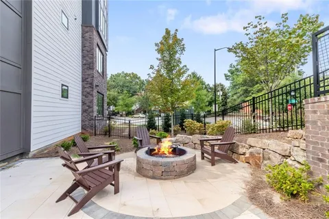 a view of a backyard with sitting area and furniture