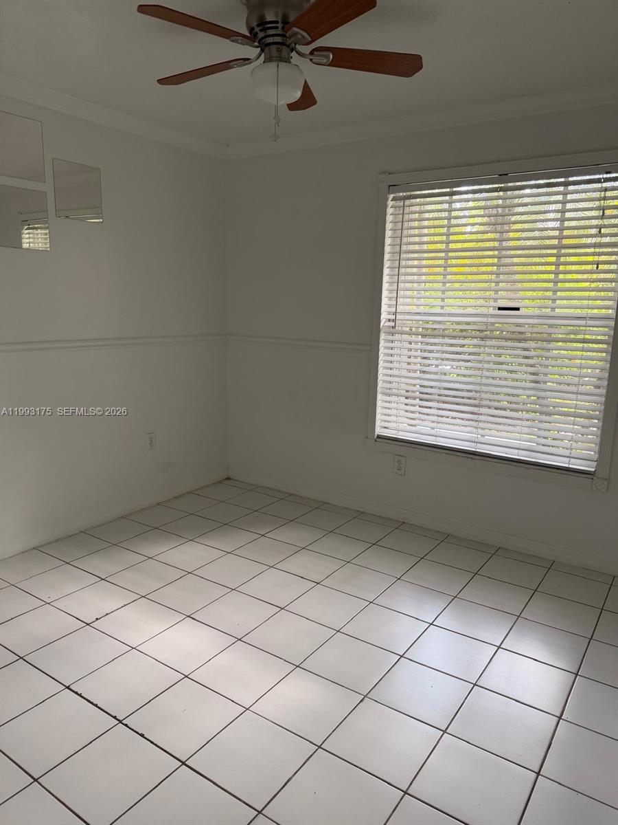12695 Southwest 144th Terrace Miami, FL 33186 - Photo 13 of 43 a view of an empty room with a window