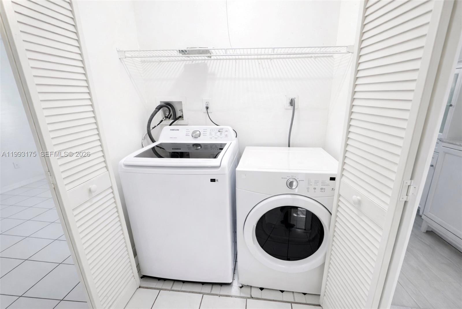 12695 Southwest 144th Terrace Miami, FL 33186 - Photo 17 of 43 a utility room with dryer and washer