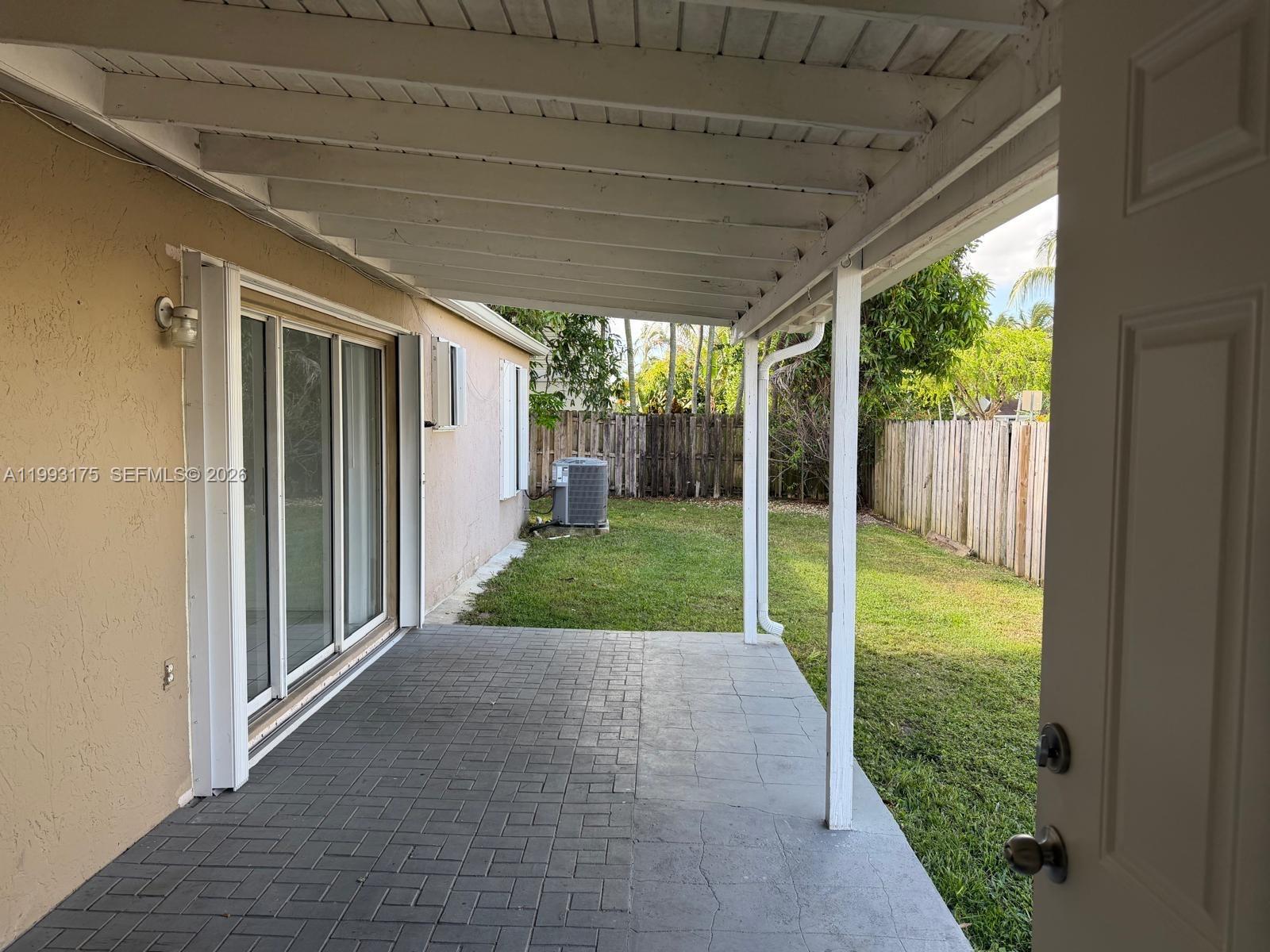12695 Southwest 144th Terrace Miami, FL 33186 - Photo 19 of 43 a view of a porch with garden