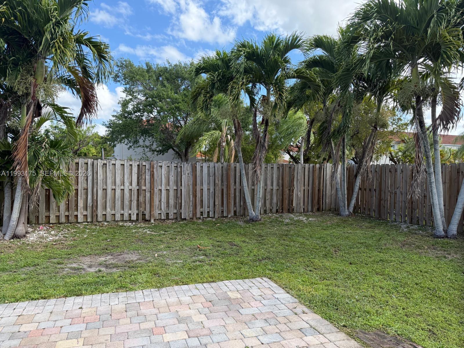 12695 Southwest 144th Terrace Miami, FL 33186 - Photo 20 of 43 a garden with wooden fence
