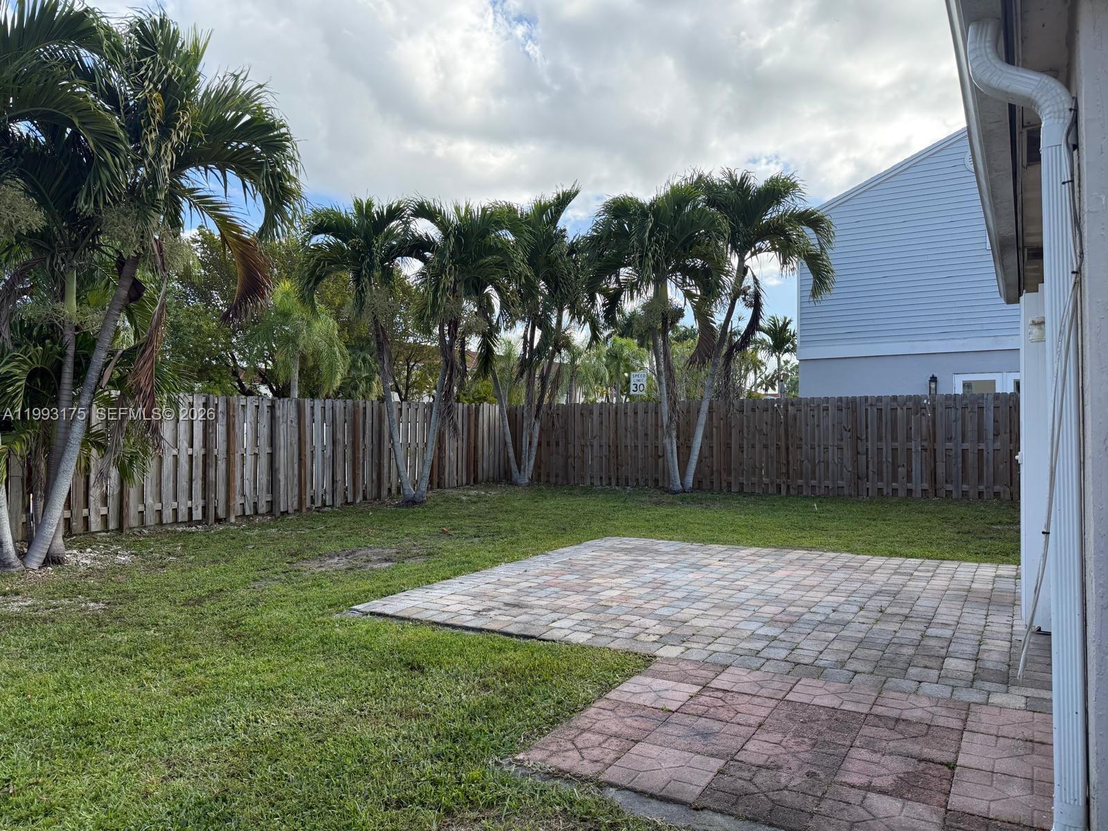 12695 Southwest 144th Terrace Miami, FL 33186 - Photo 21 of 43 a view of a backyard with palm tree